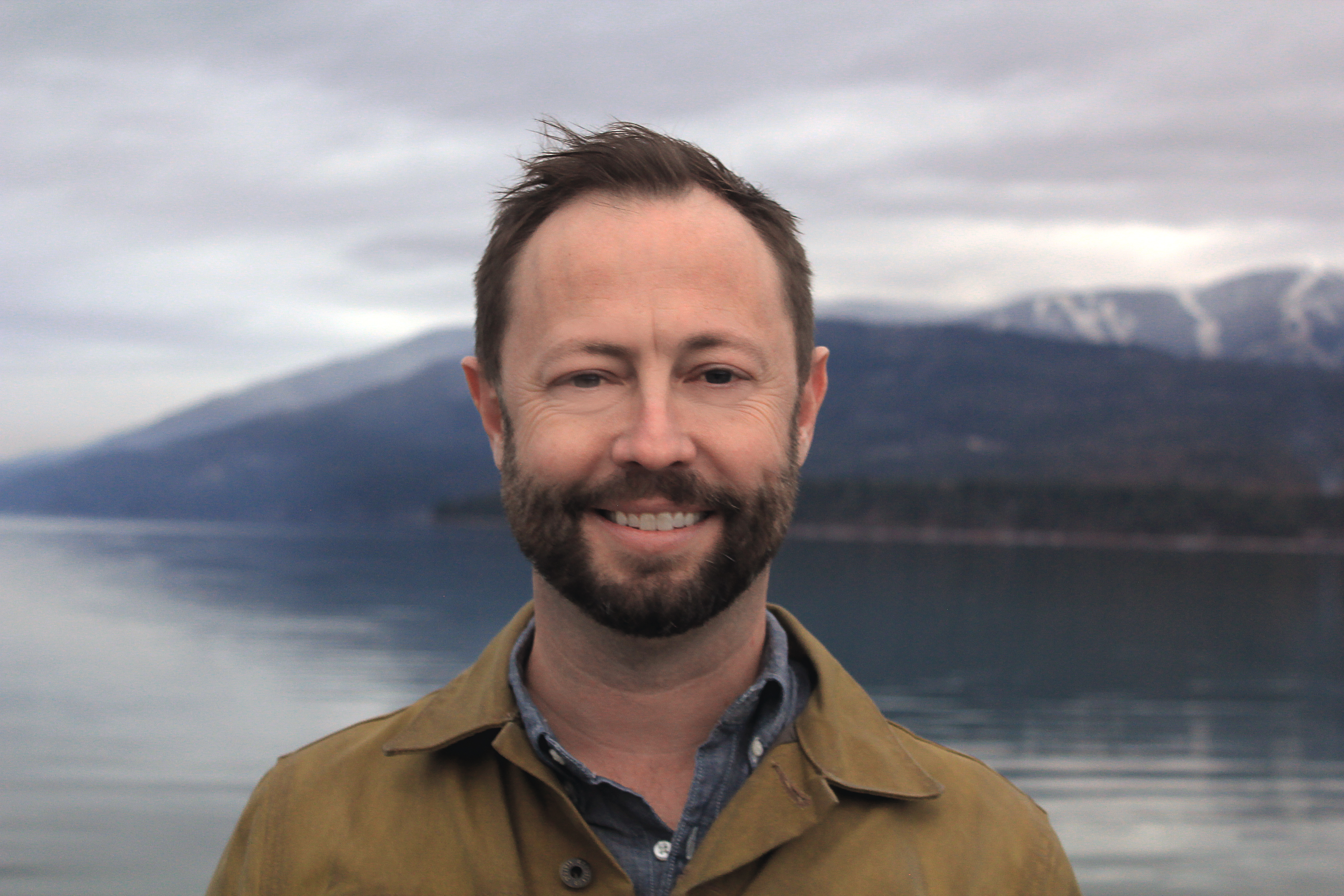Bo Downen Headshot in front of lake